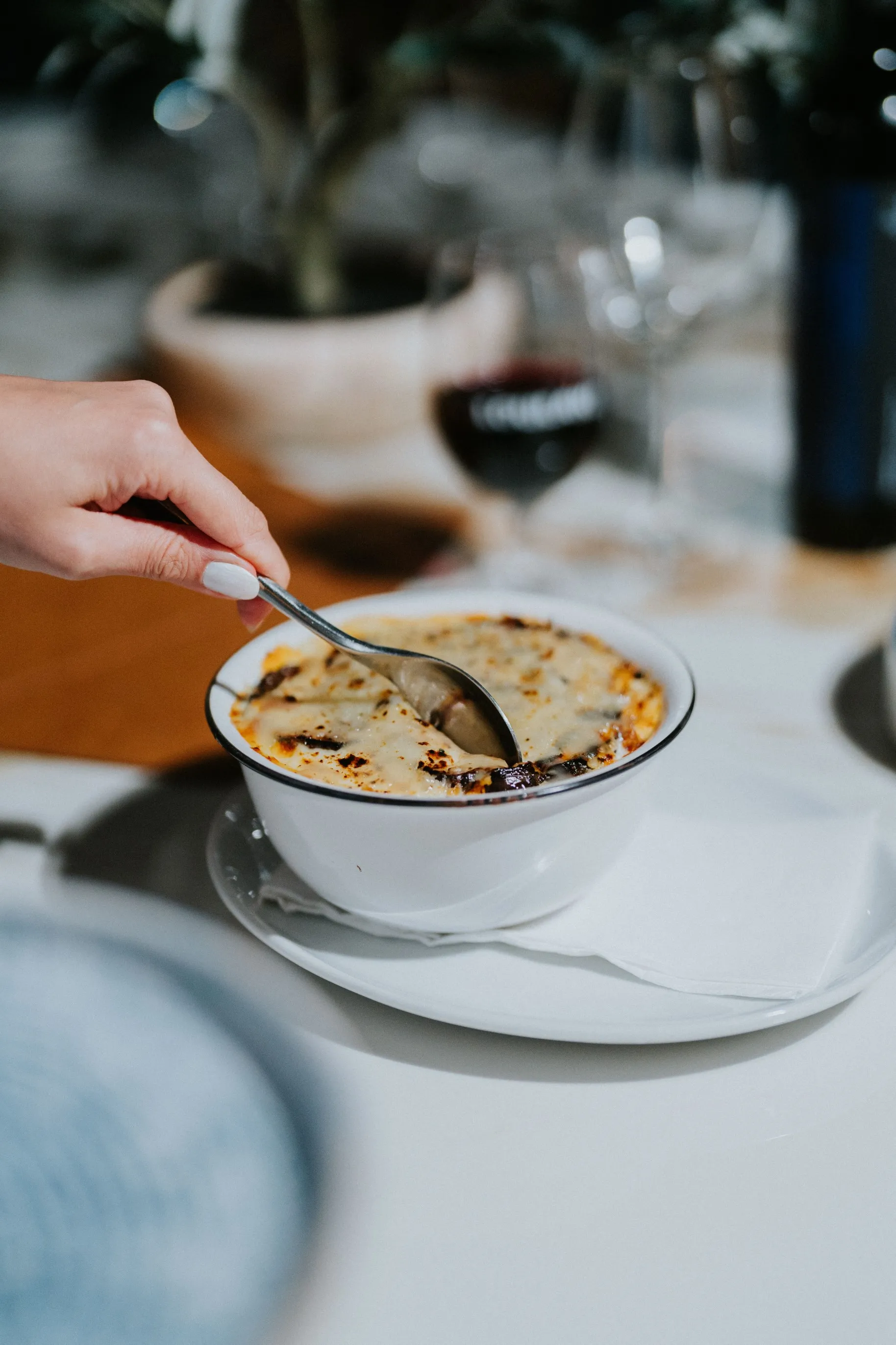 A person holding a spoon, ready to take a delicious bite.