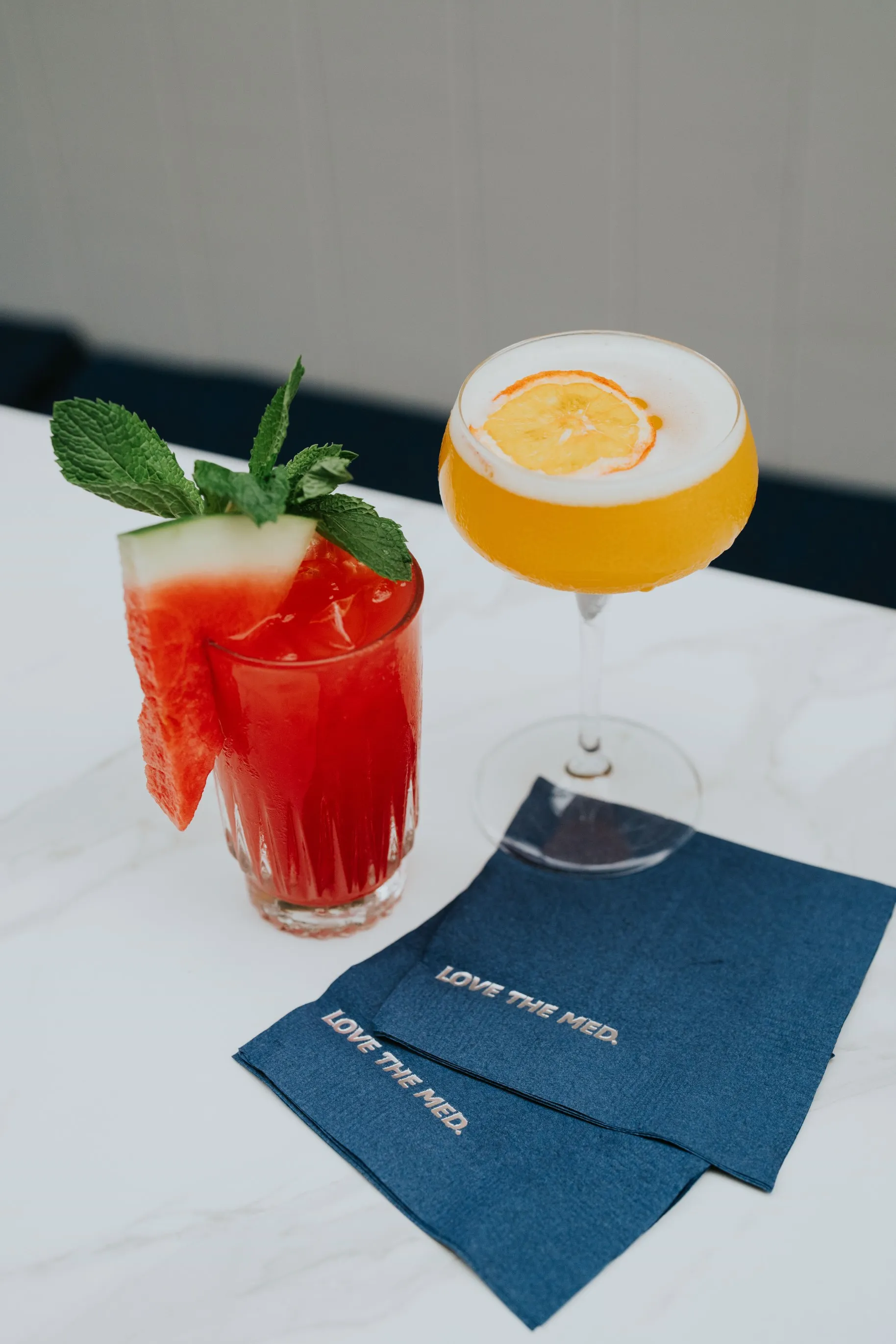 A refreshing drink with a watermelon garnish