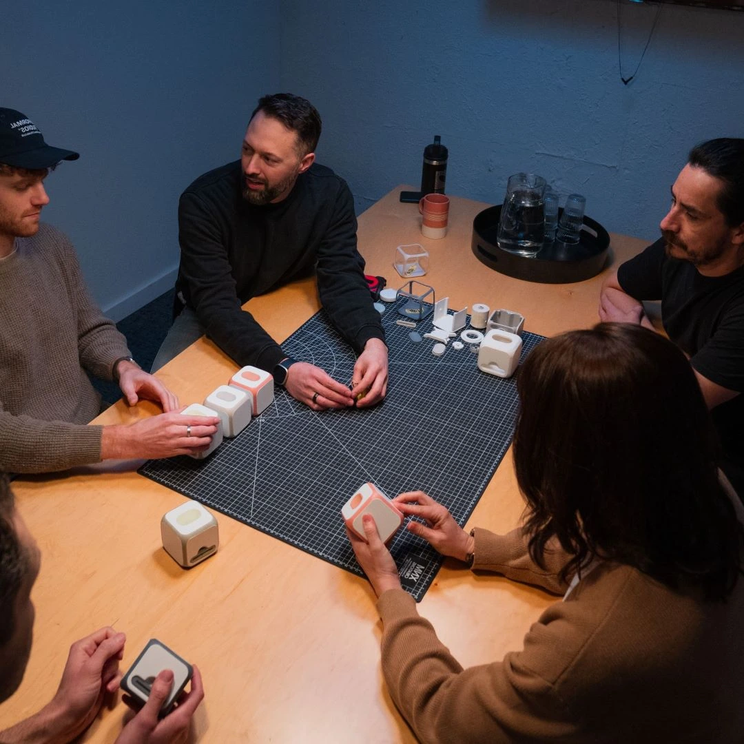 ANCORD Design team reviewing product prototypes during a collaborative design session
