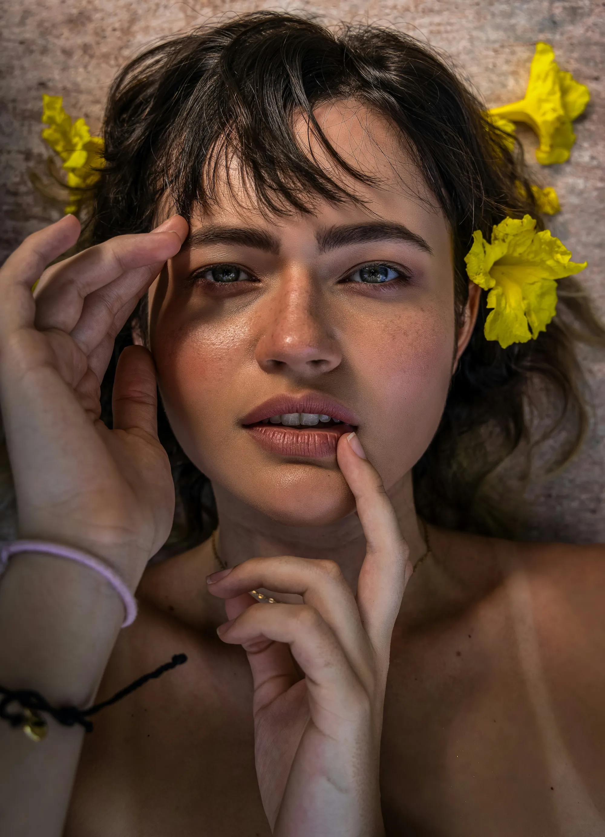 girl after aesthetics treatments with flower in her hair