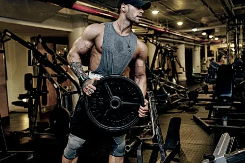 Body builder racking weights in chelsea new york city at completebody.