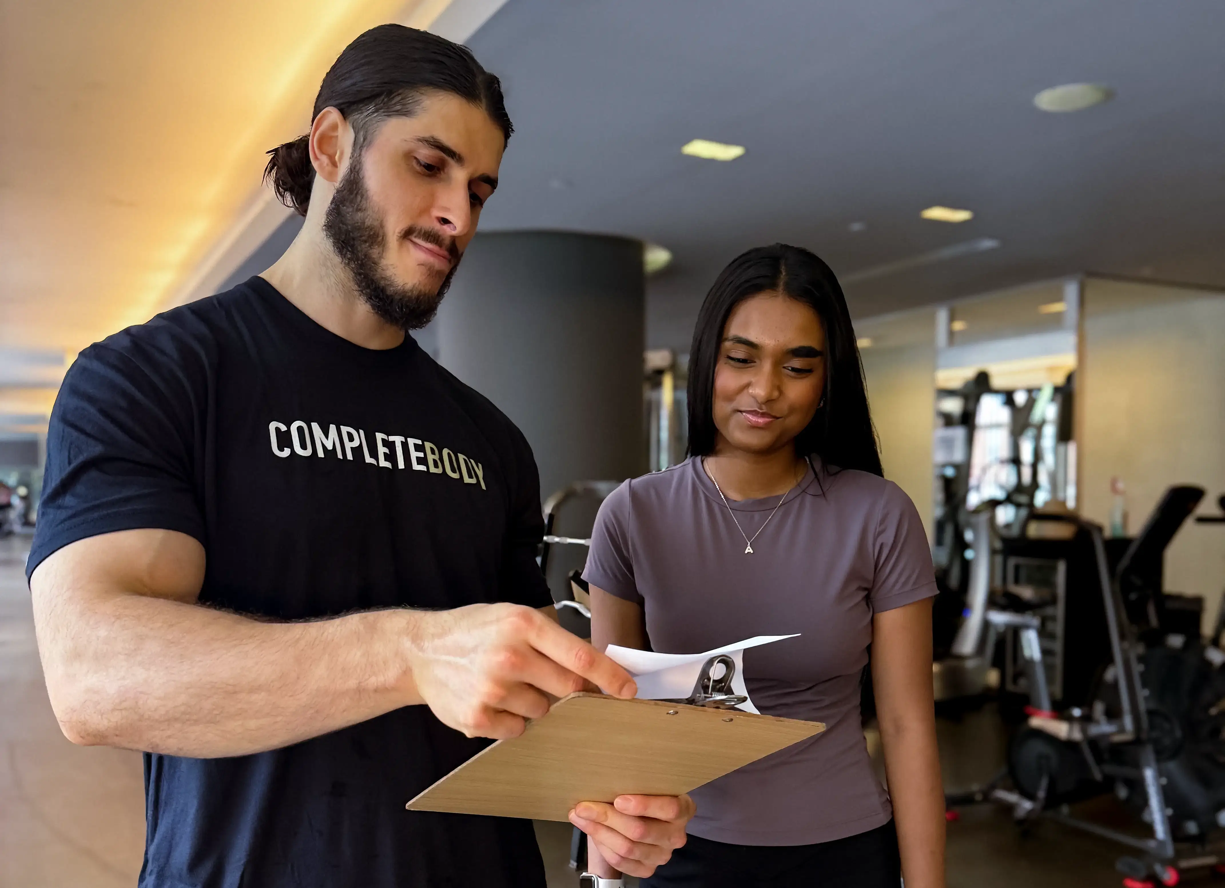 NYC Personal trainer helping client with a nutrition plan.
