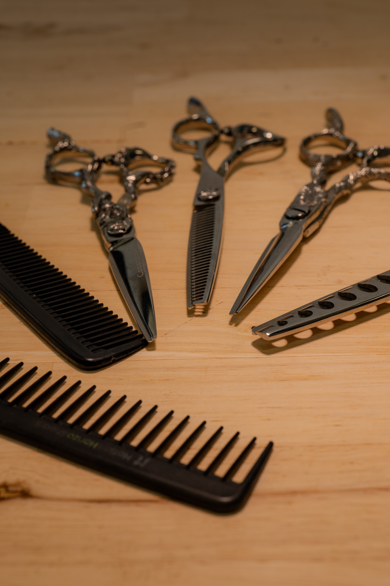 A person cutting woman's hair