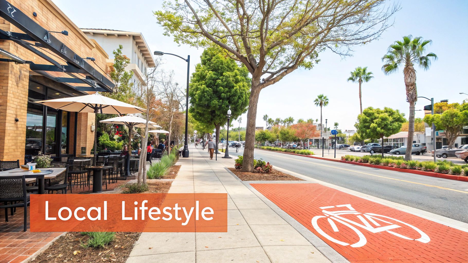 A vibrant street scene with an outdoor cafe, a dedicated bike lane, and people enjoying the sunny local lifestyle.
