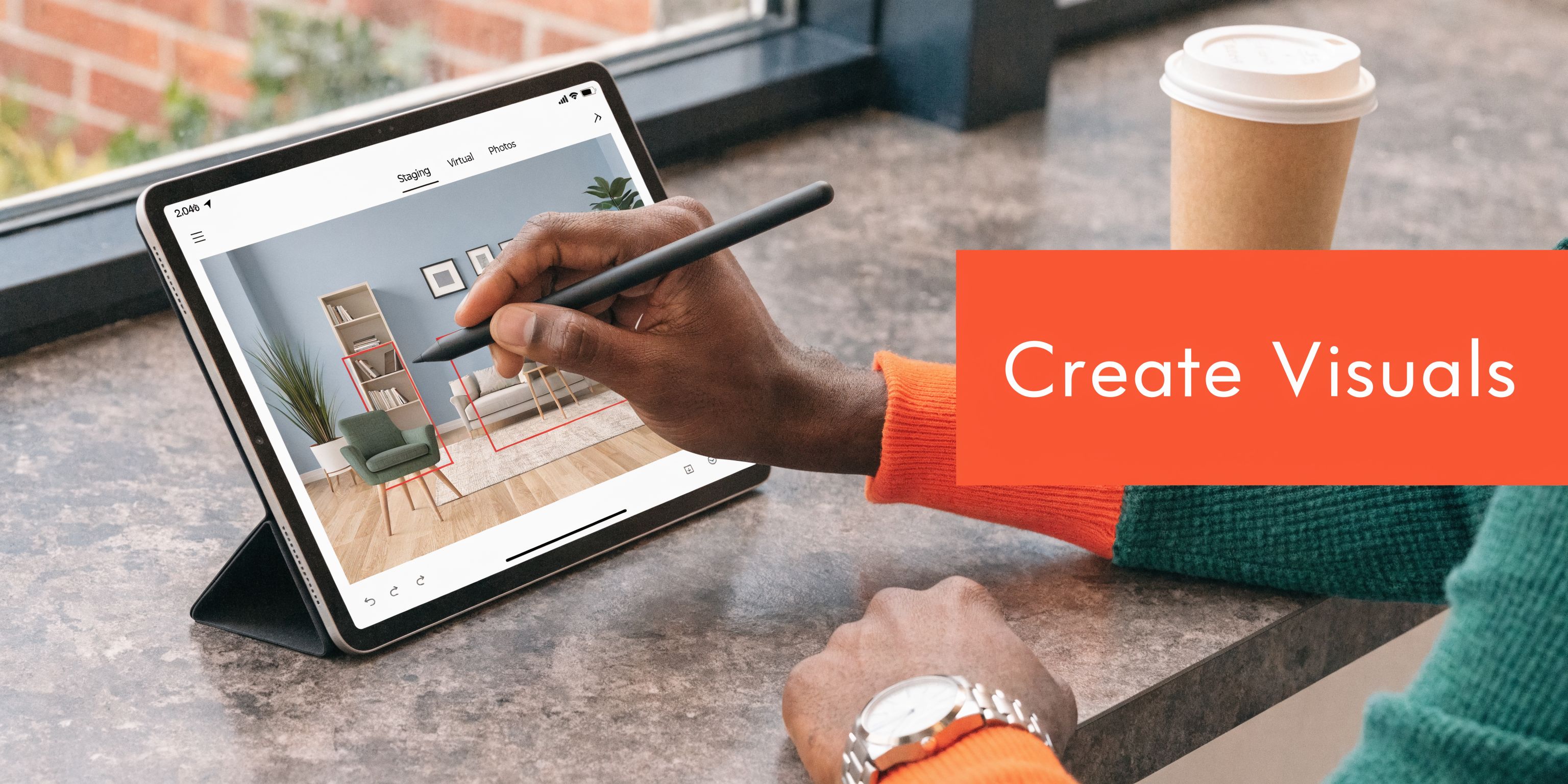 A person using a stylus to digitally stage furniture in a home interior photo on a tablet.