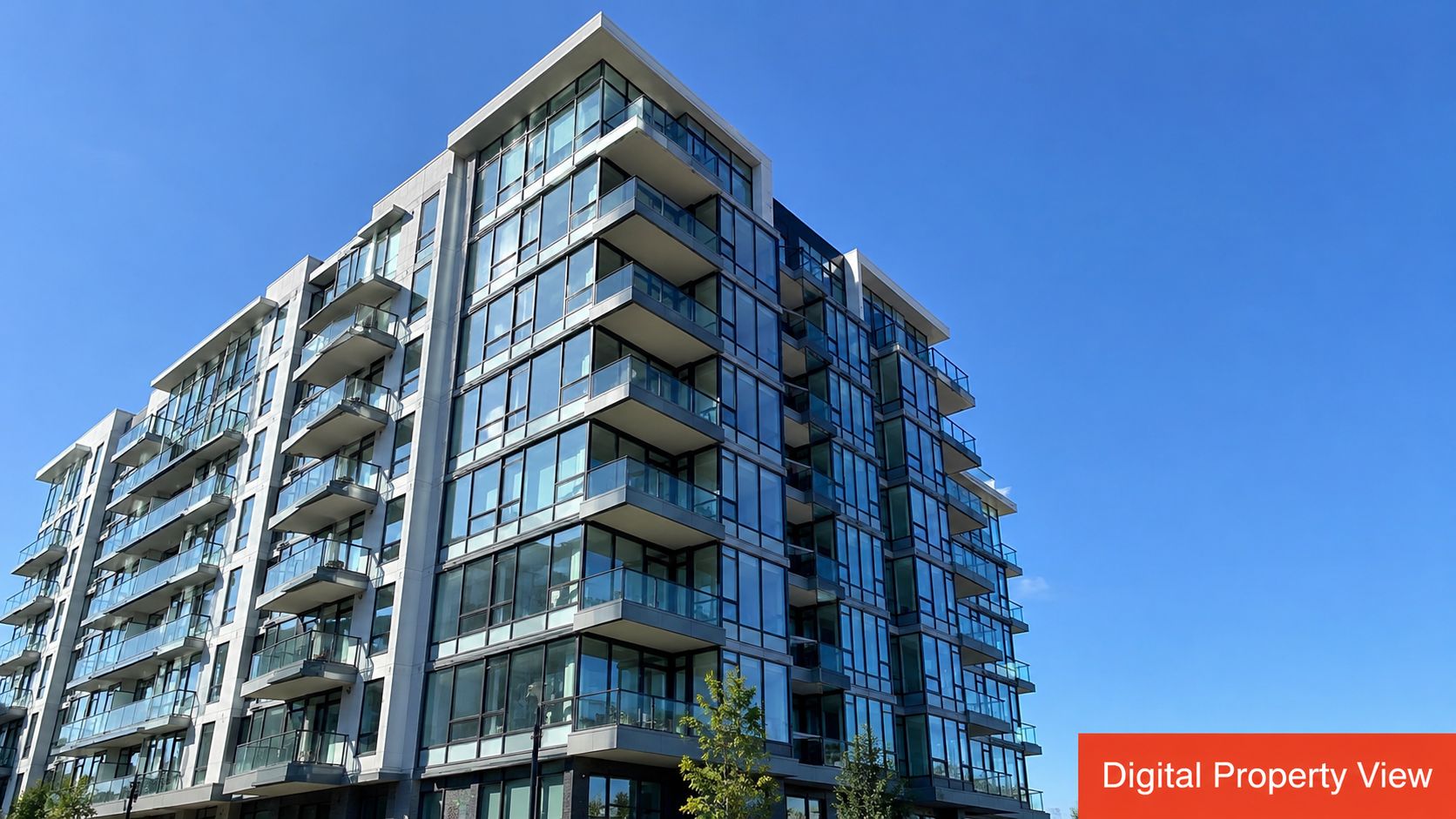 A modern multi-story apartment building with glass balconies under a clear, bright blue summer sky.