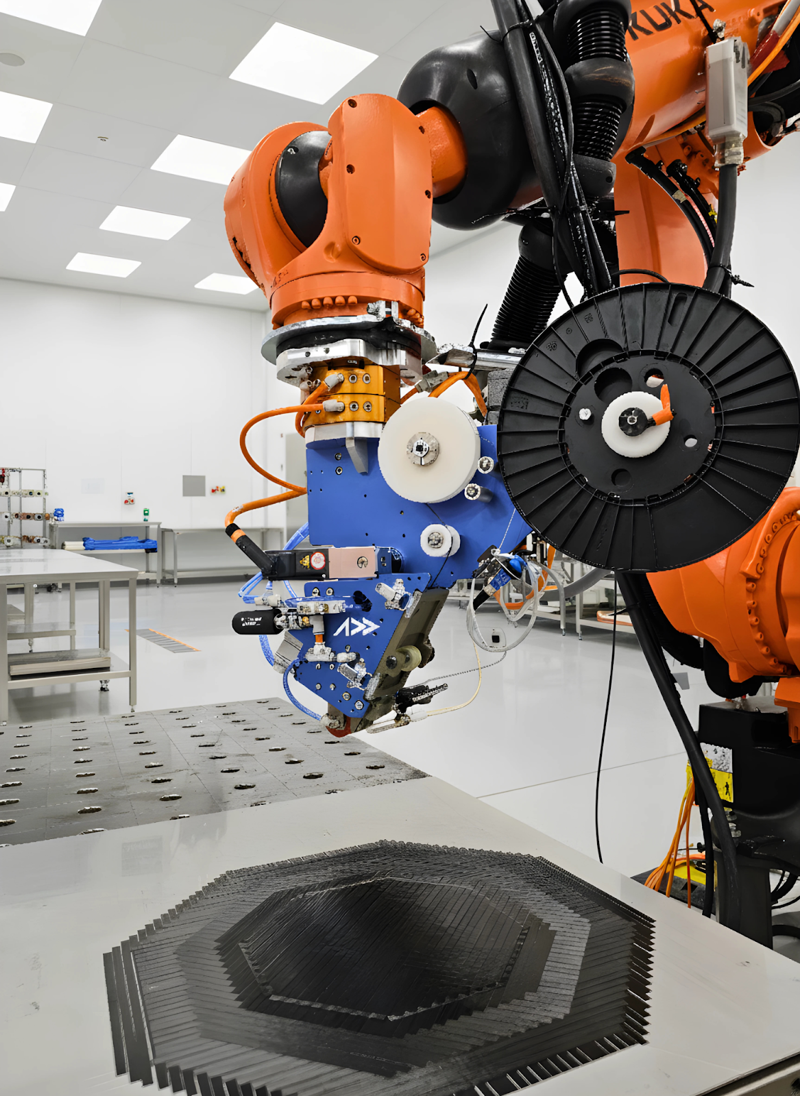 Addcomposites AFP-XS system mounted on a KUKA robot arm performing automated fiber placement