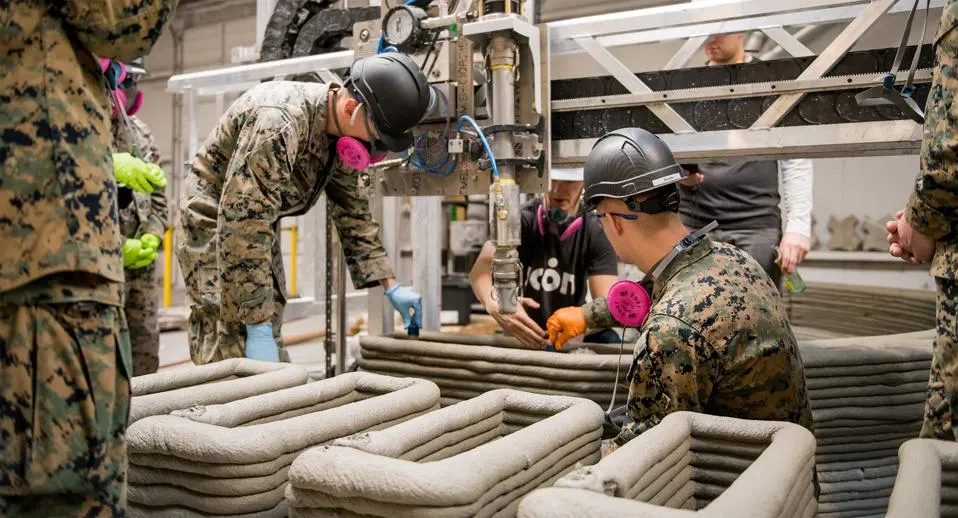 U.S. Marines operating a field-deployed 3D printing unit