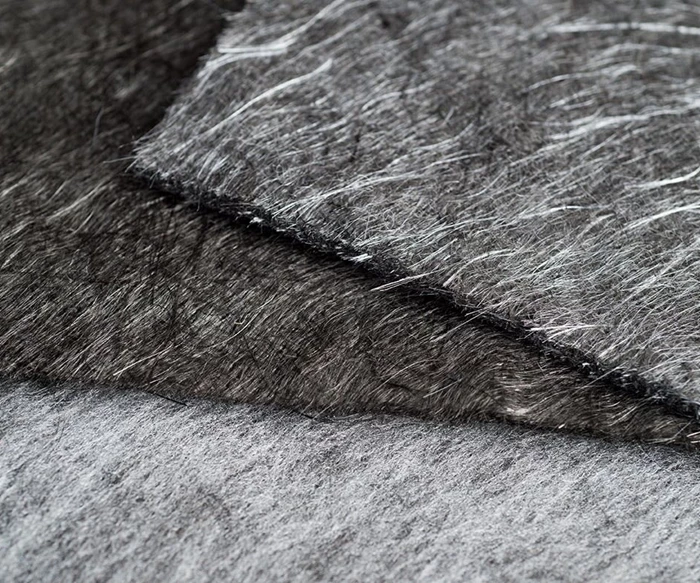 Recycled carbon fiber mat showing randomly oriented de-sized filaments