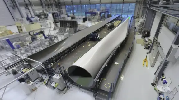 A carbon fibre wind turbine blade taking shape on the factory floor.