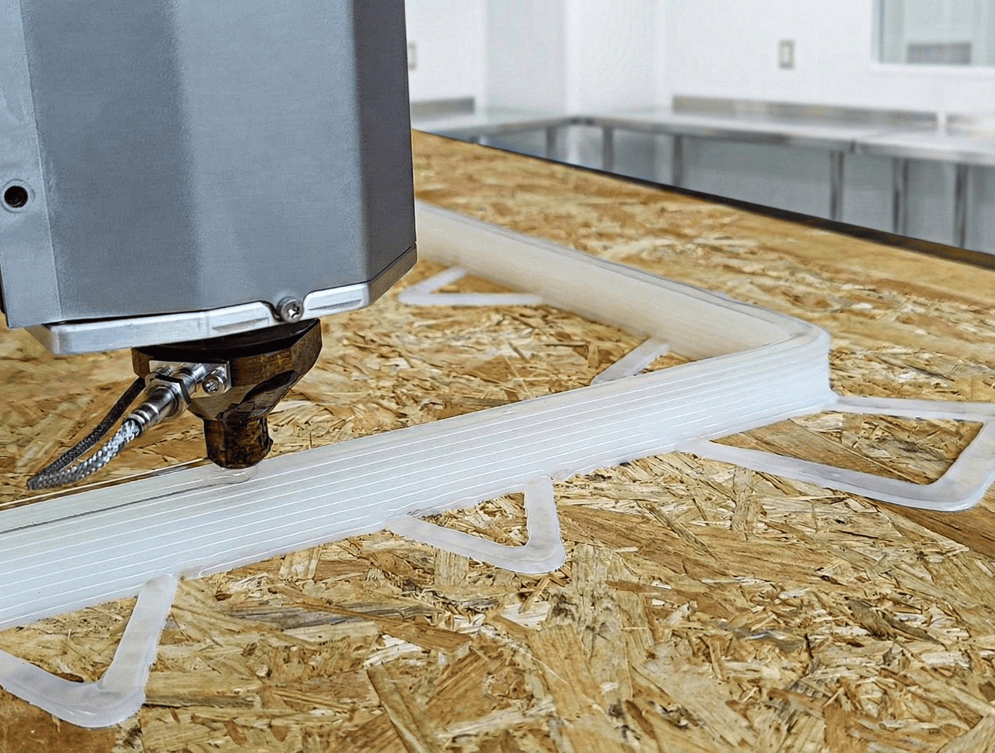 ADDX continuous fiber print head depositing material