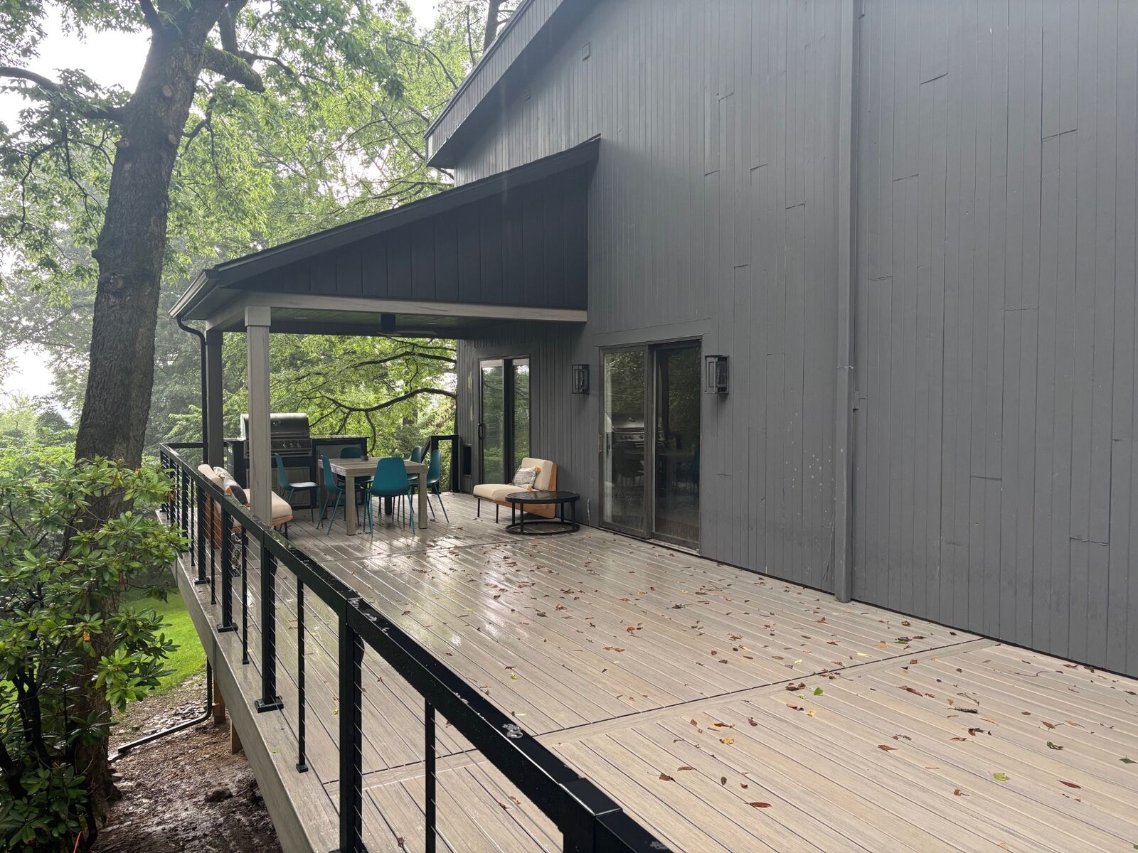 Contemporary deck with outdoor kitchen