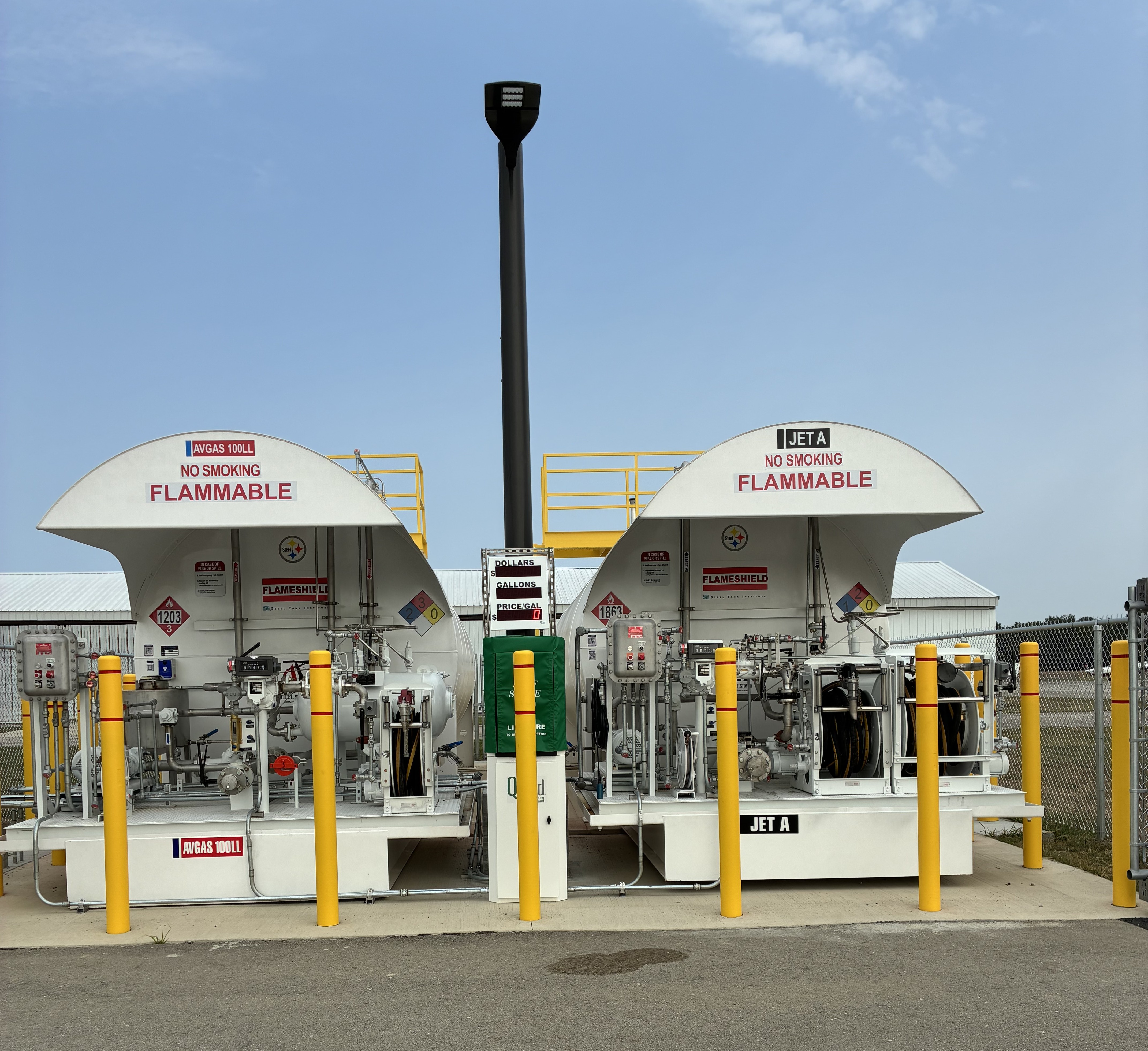 Outside Photo showing Fuel tanks, Left is AVGAS 100LL. Right is Jet A
