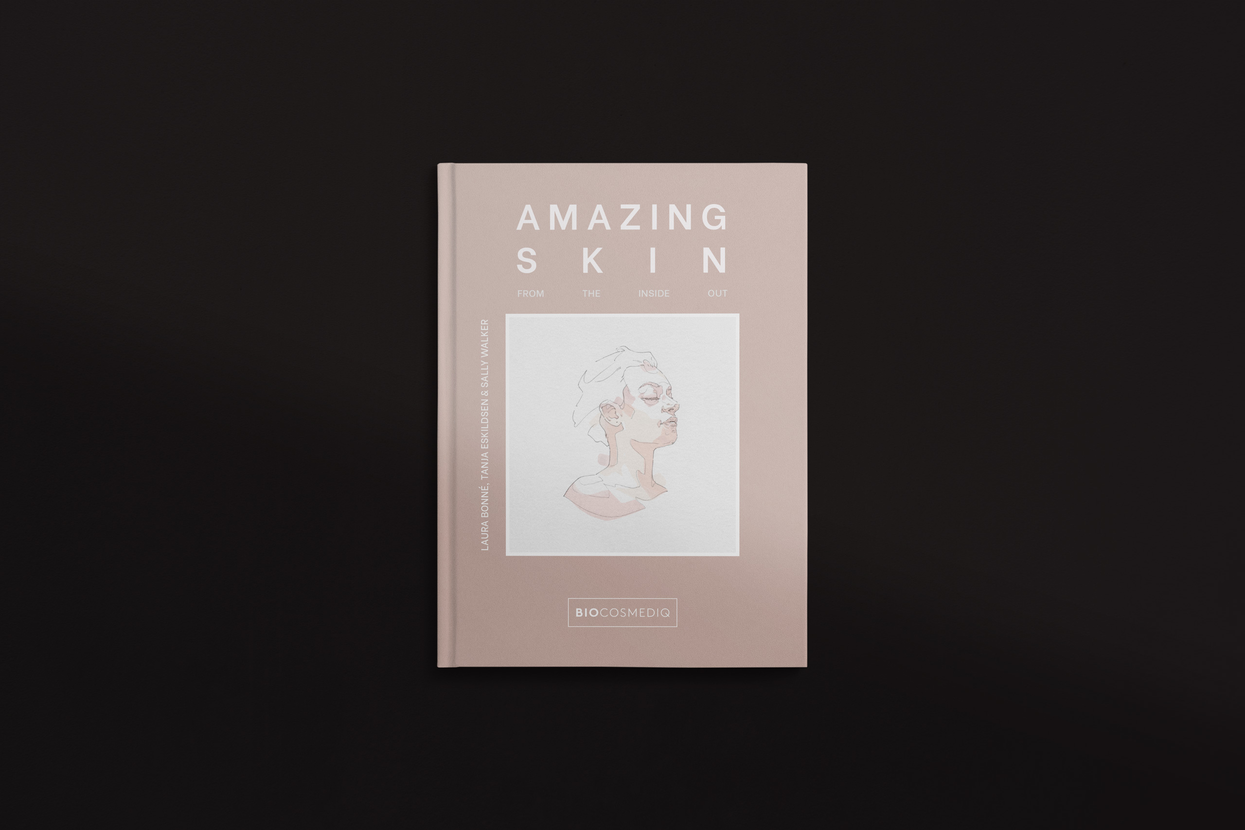 Minimalist book cover design for a skincare guide titled “Amazing Skin From the Inside Out,” featuring a soft blush pink background and a delicate line illustration of a serene female face in profile at the center. The authors—Laura Bonne, Tanja Eskildsen, and Sally Walker—are listed vertically along the left, and the publisher, BIOCOSMEDIQ, appears in a white box at the bottom.