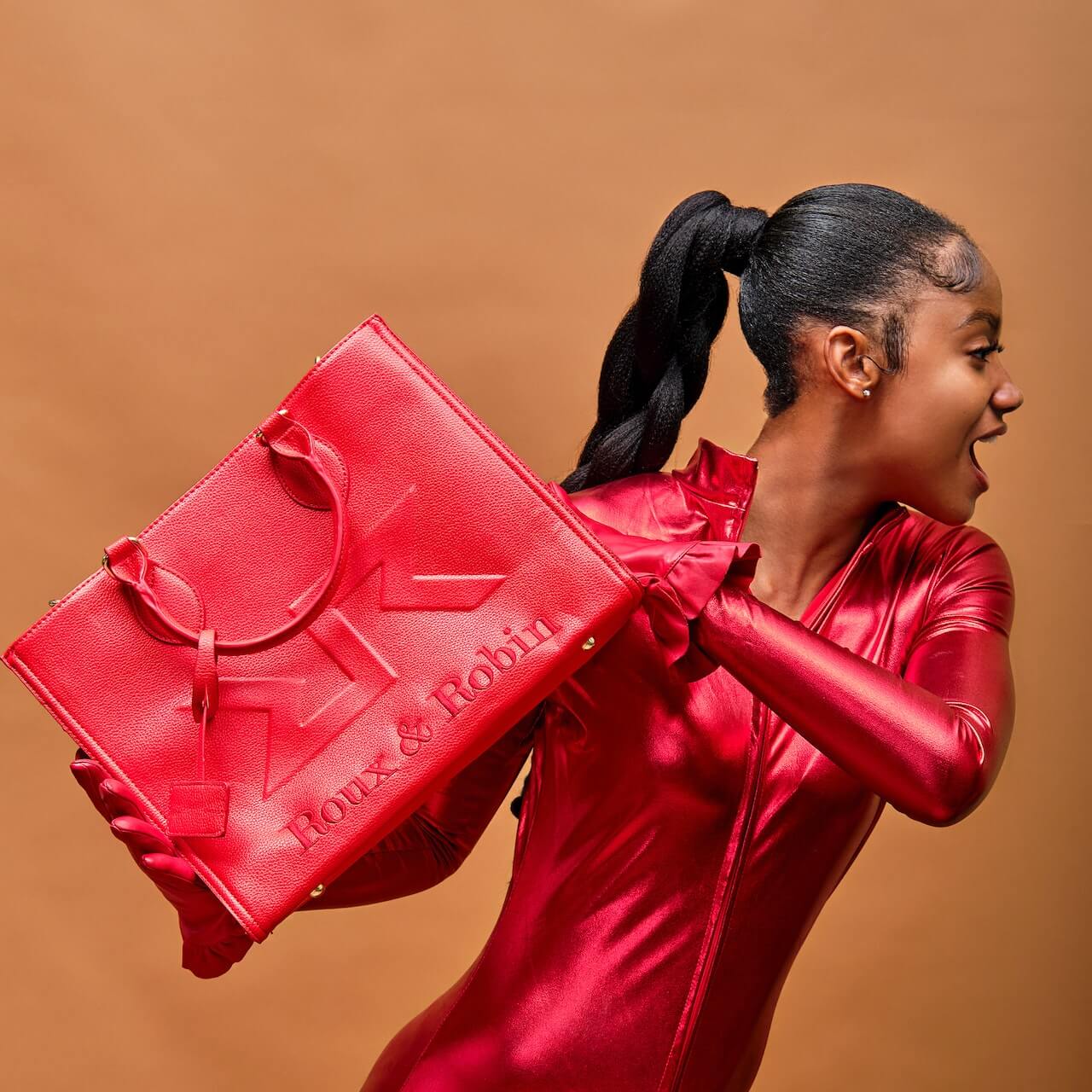 Woman holding a red bag