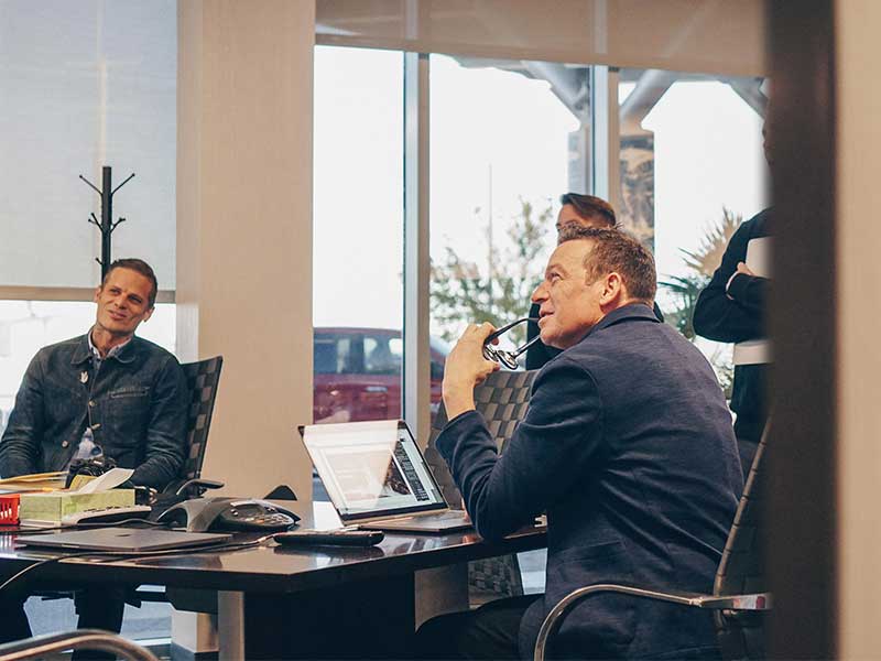 Kelly Smith in a meeting conference room with managers of MGM digital ventures