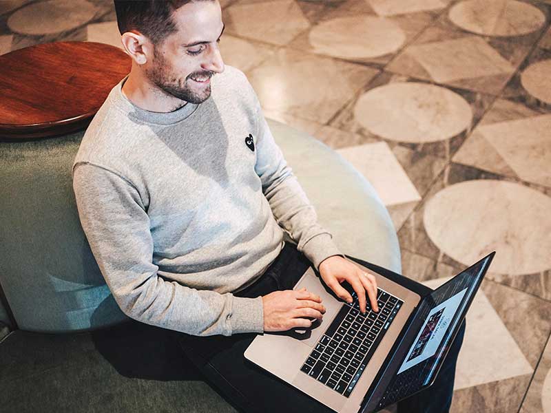 Designer inside the hotel lobby. Working on digital ventures projects.