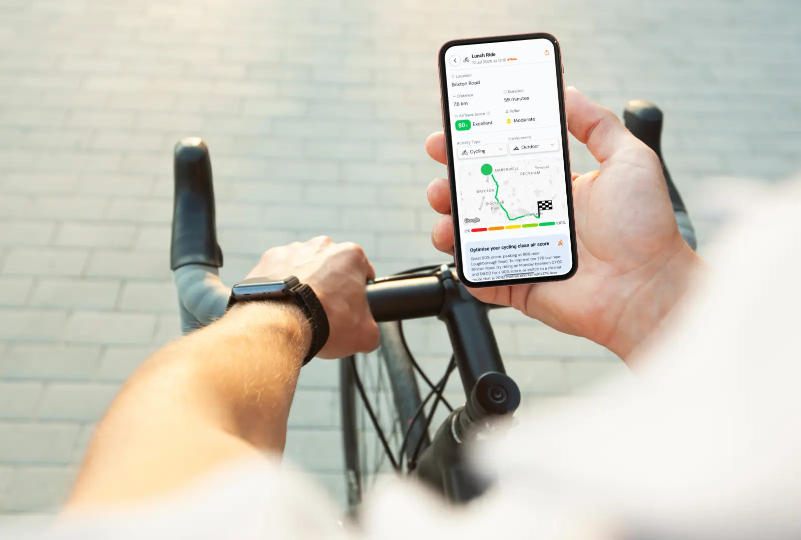 Cyclist checking a cleaner route in AirTrack on the handlebars