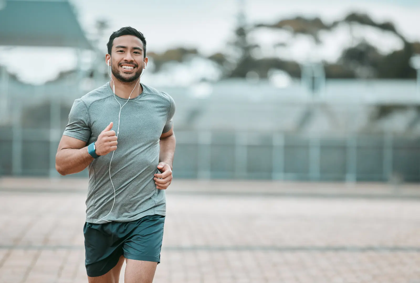 Athlete running along a beach