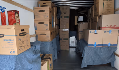 Moving boxes loaded inside a moving truck 