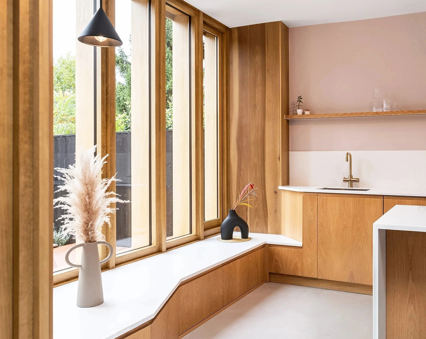 Oak kitchen cabinetry combine with oak framed glazed screen in Kitchen of Victorian end-terrace house in Chorlton, Manchester, UK.