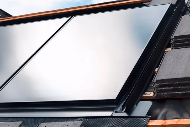 An image of integrated solar panels on a residential roof. Panels are all black.