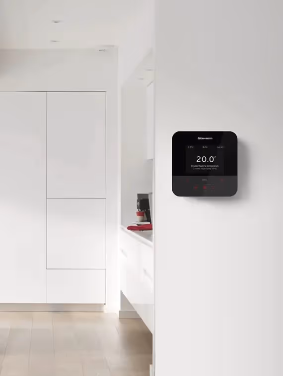 A Glowworm thermostat on a wall in a home
