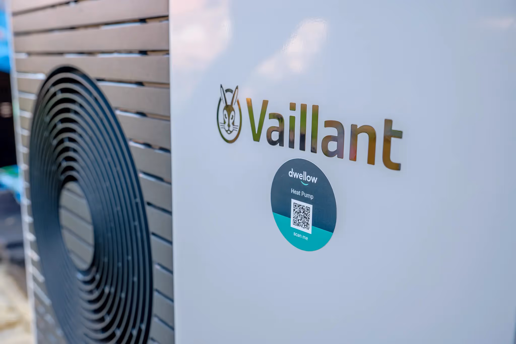 A side on image of a Vaillant aroTherm Plus with a dwellow sticker on it