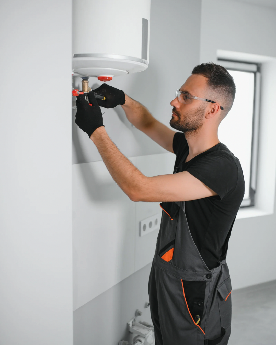 Engineer repairing a boiler