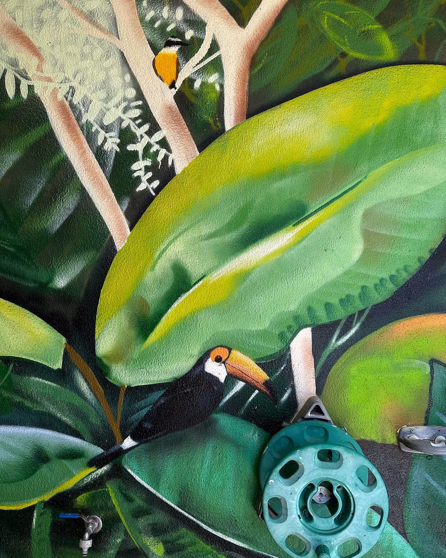Tropical leaves mural painting with some birds