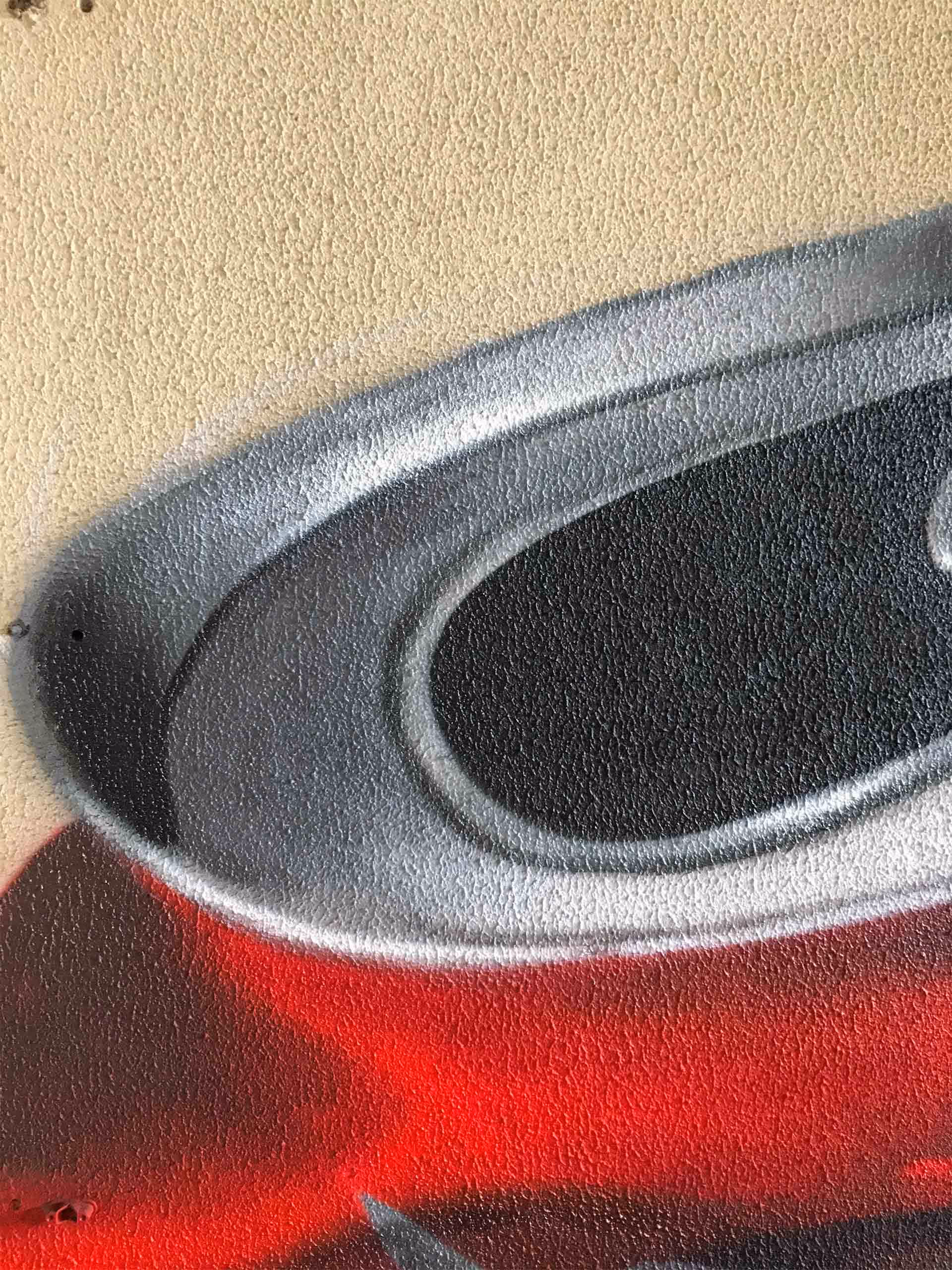 Details of a 3D graffiti painting of a damaged Coca-Cola can