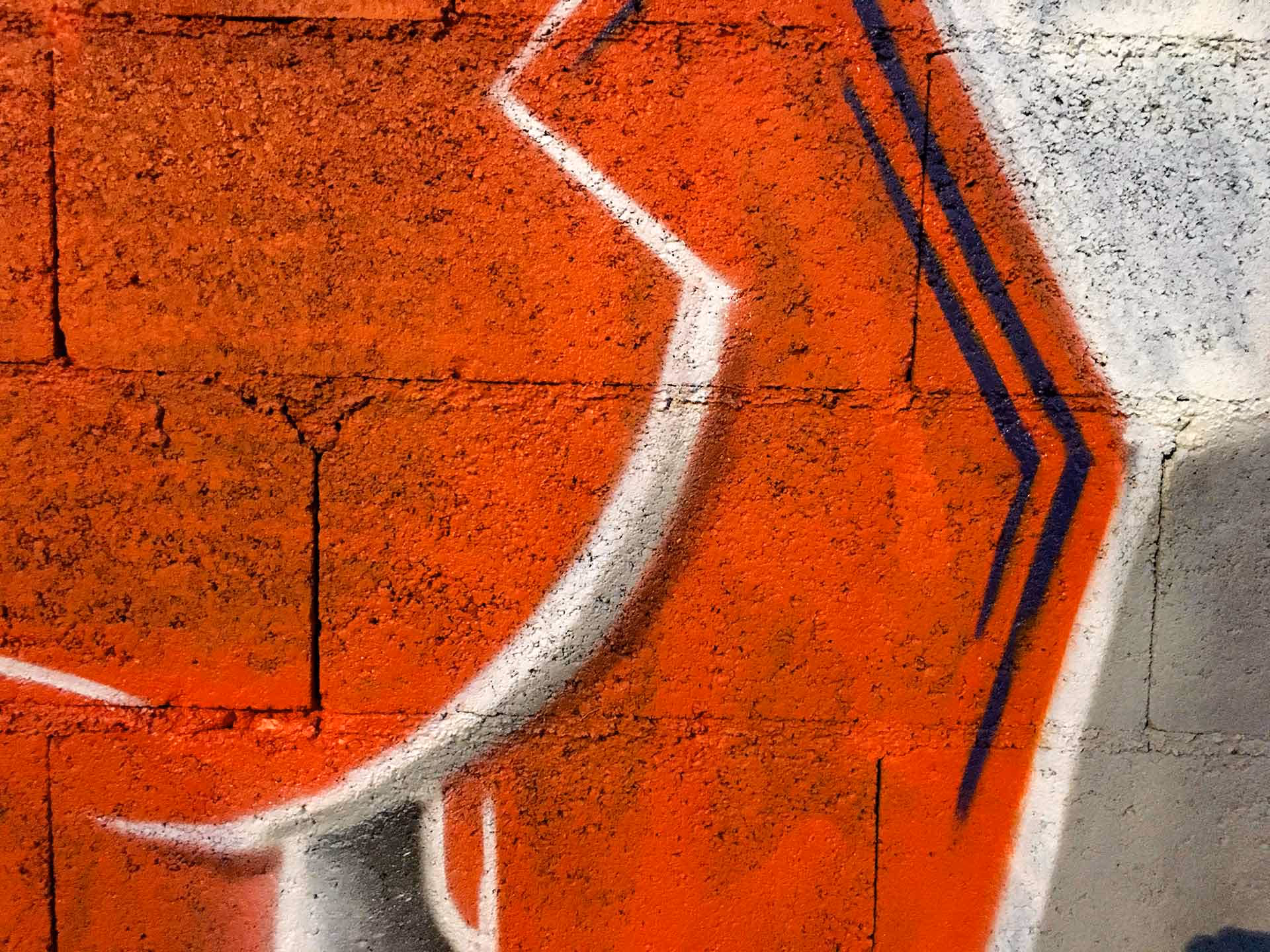 Details of a blue and orange Kilos graffiti piece