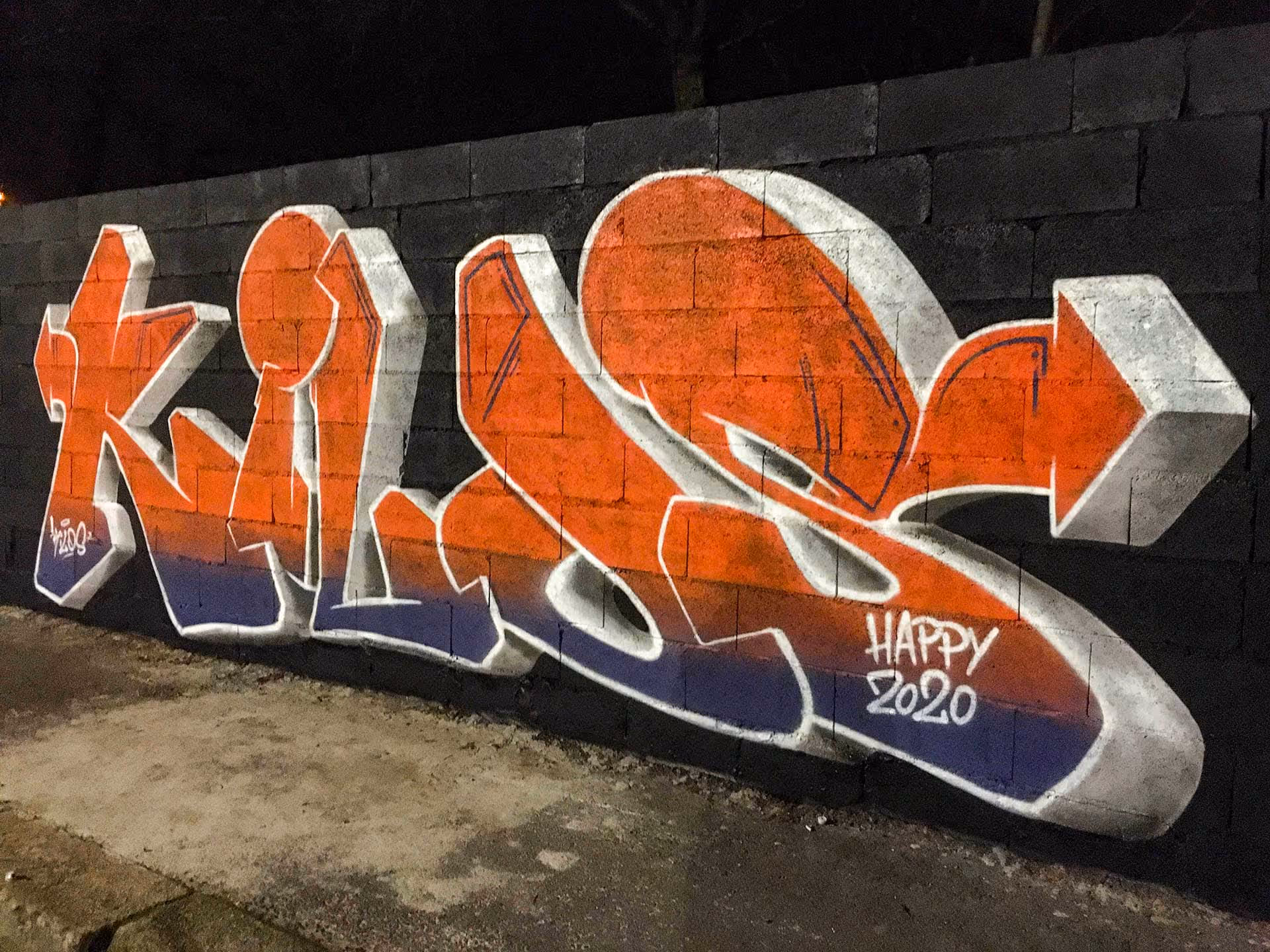 A blue and orange Kilos graffiti piece