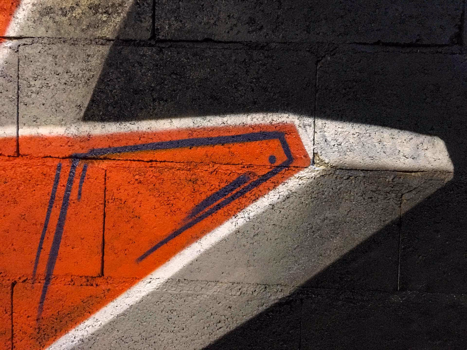 Details of a blue and orange Kilos graffiti piece