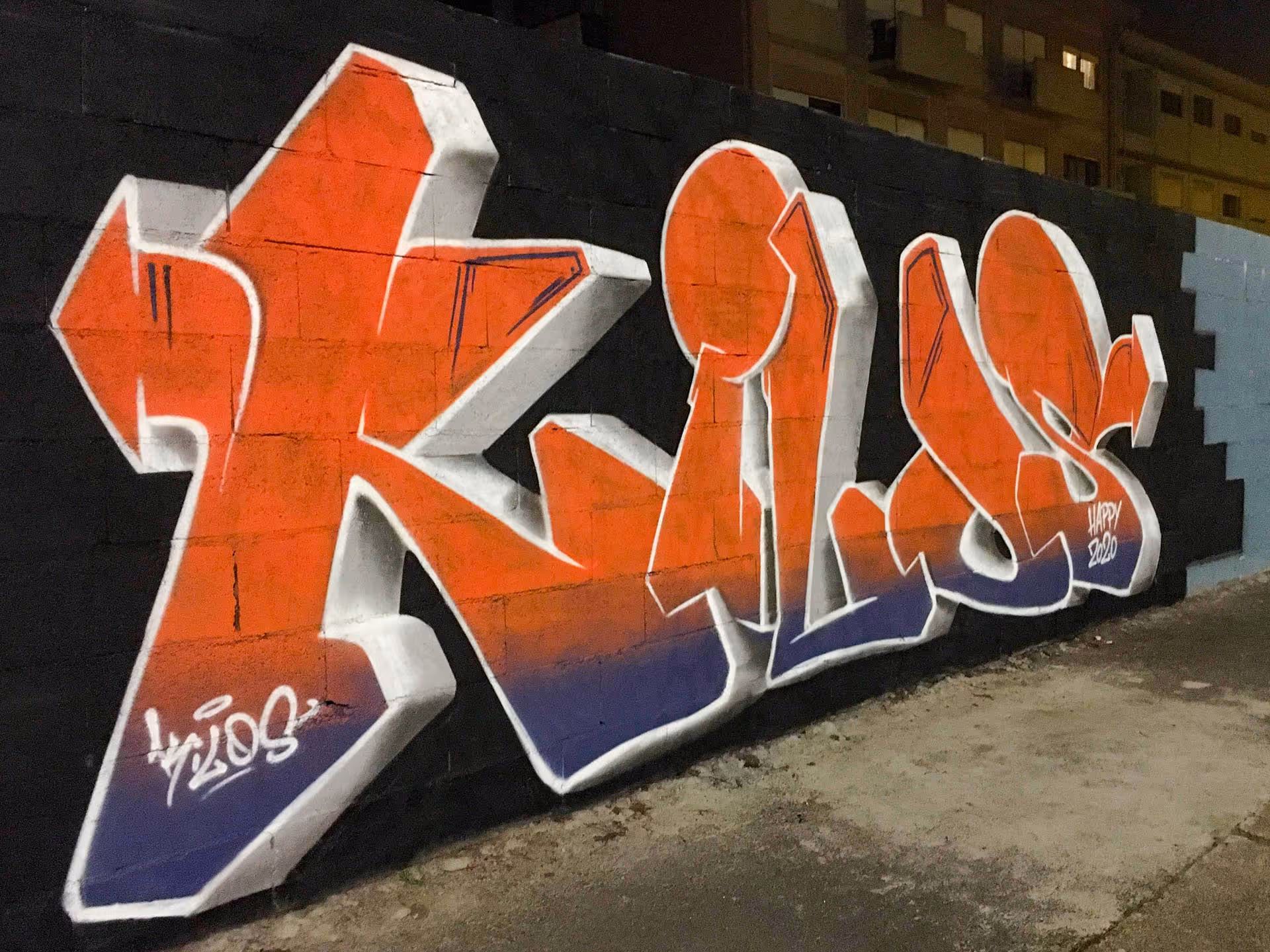 A blue and orange Kilos graffiti piece