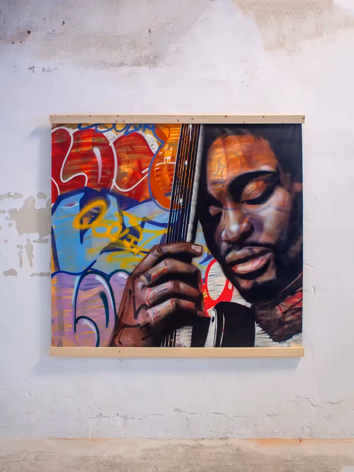 D'Angelo portrait painting on a canvas over a colorful graffiti background