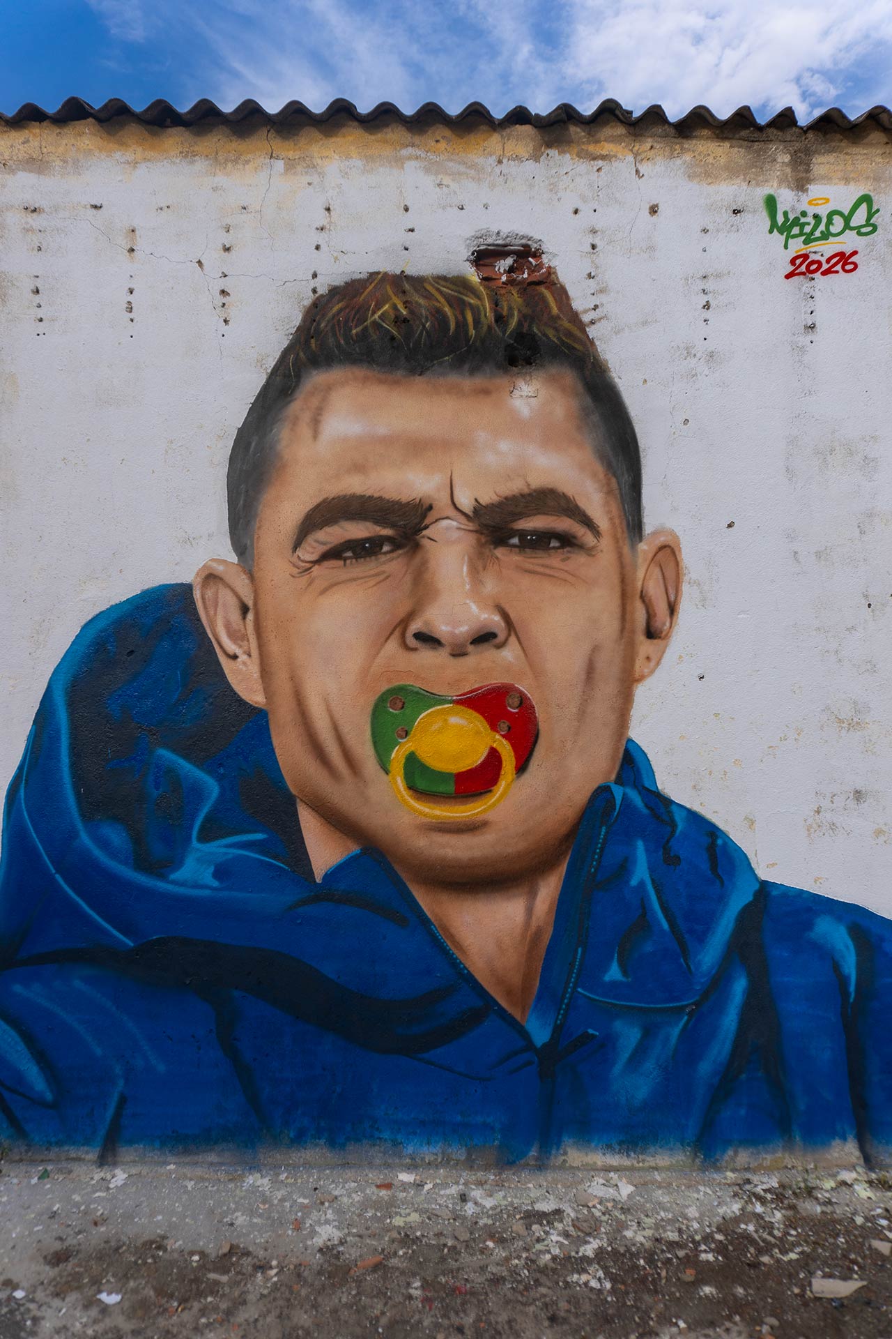 Painting of Cristiano Ronaldo sucking on a pacifier made with Portugal's colors