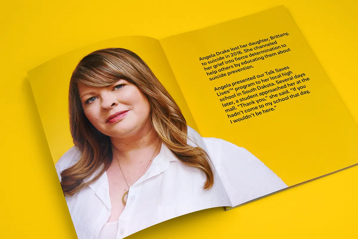 Photo of a spread of an impact report.