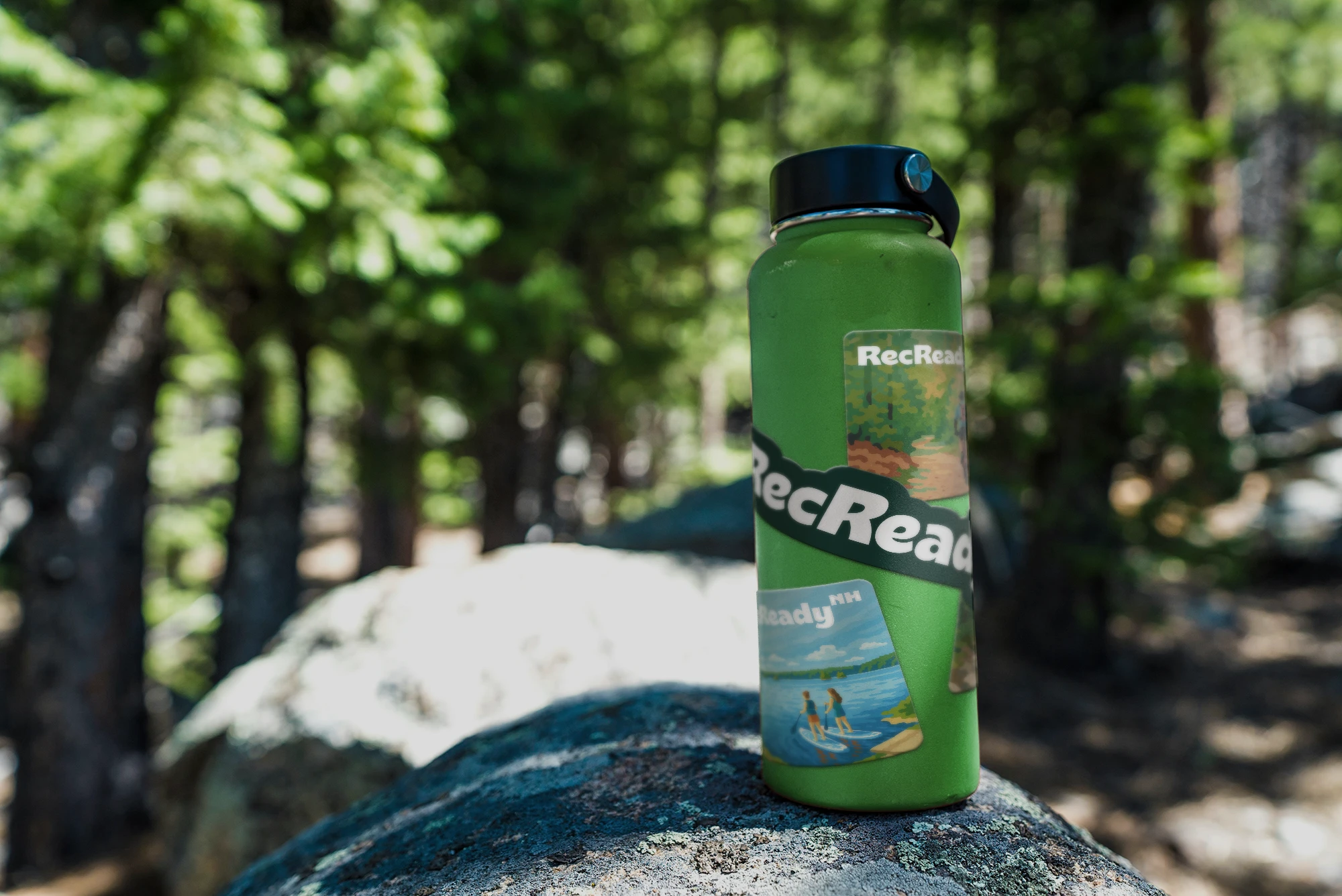 Photo of a water bottle with stickers.
