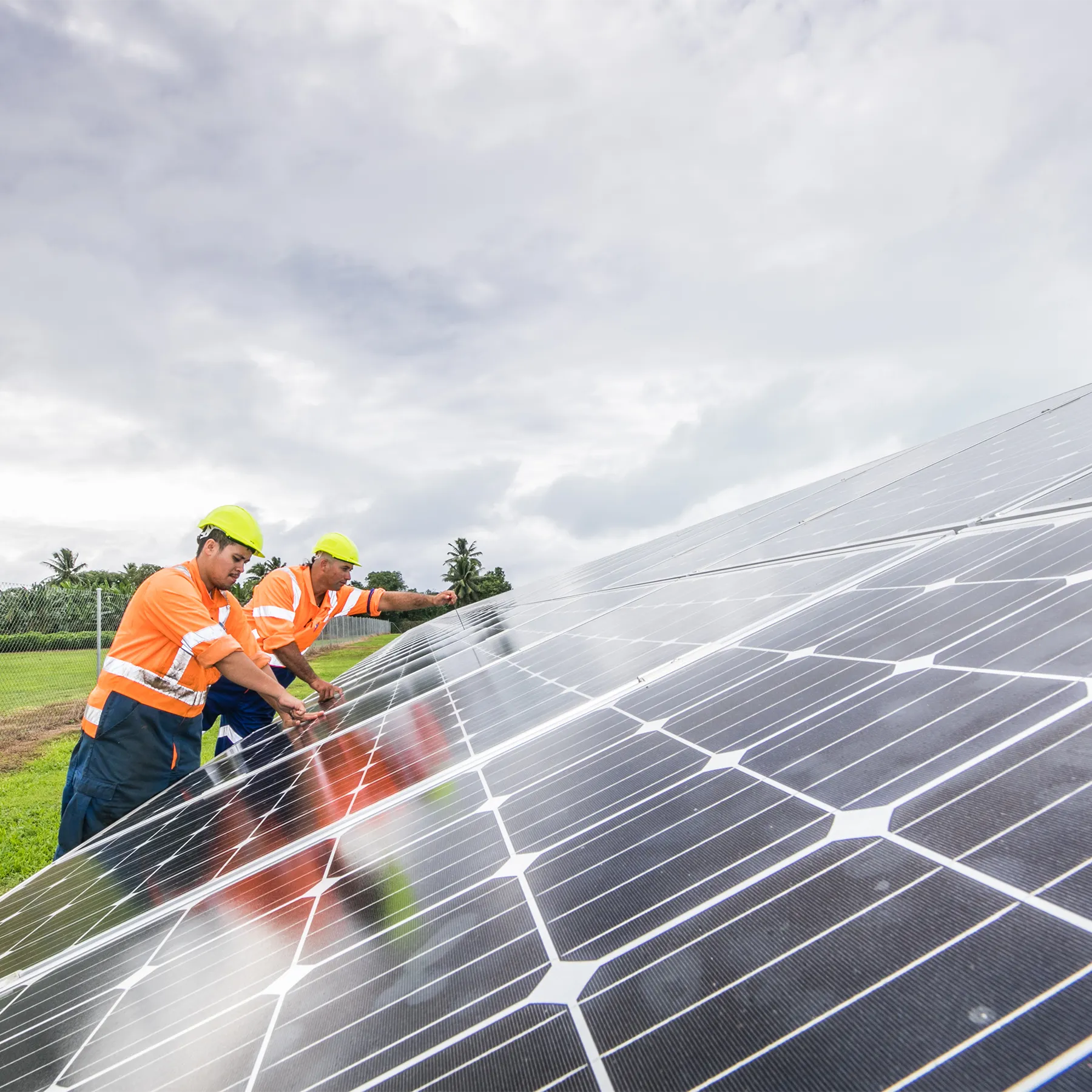 Photo of solar panel technicians.