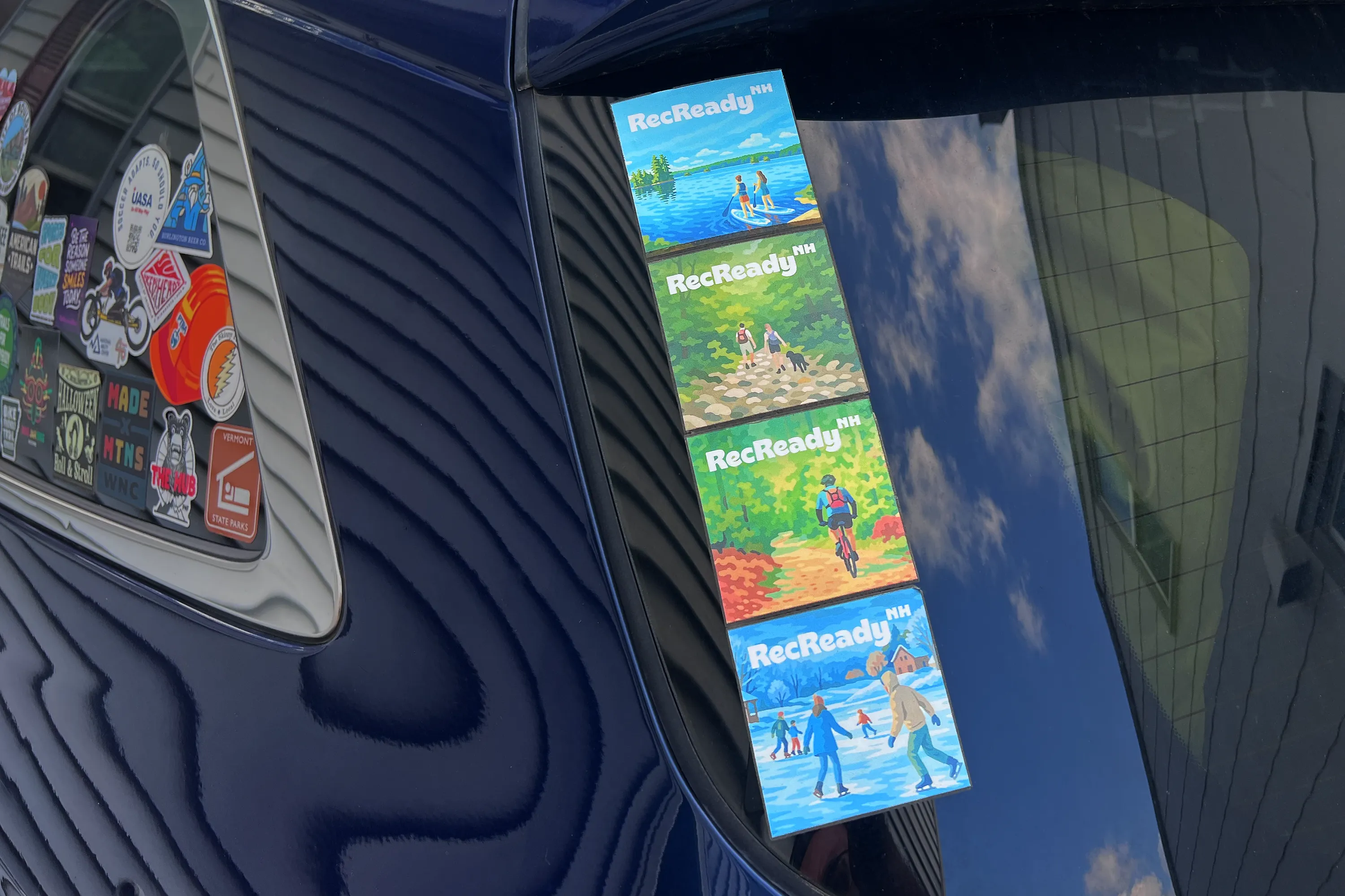 Stickers on the rear window of a car  for Rec Ready NH case study.