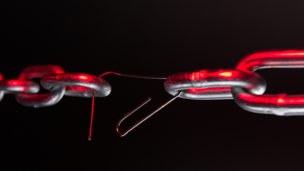 Person breaking through a wall of limiting beliefs, symbolising the liberation that comes from mindset mastery