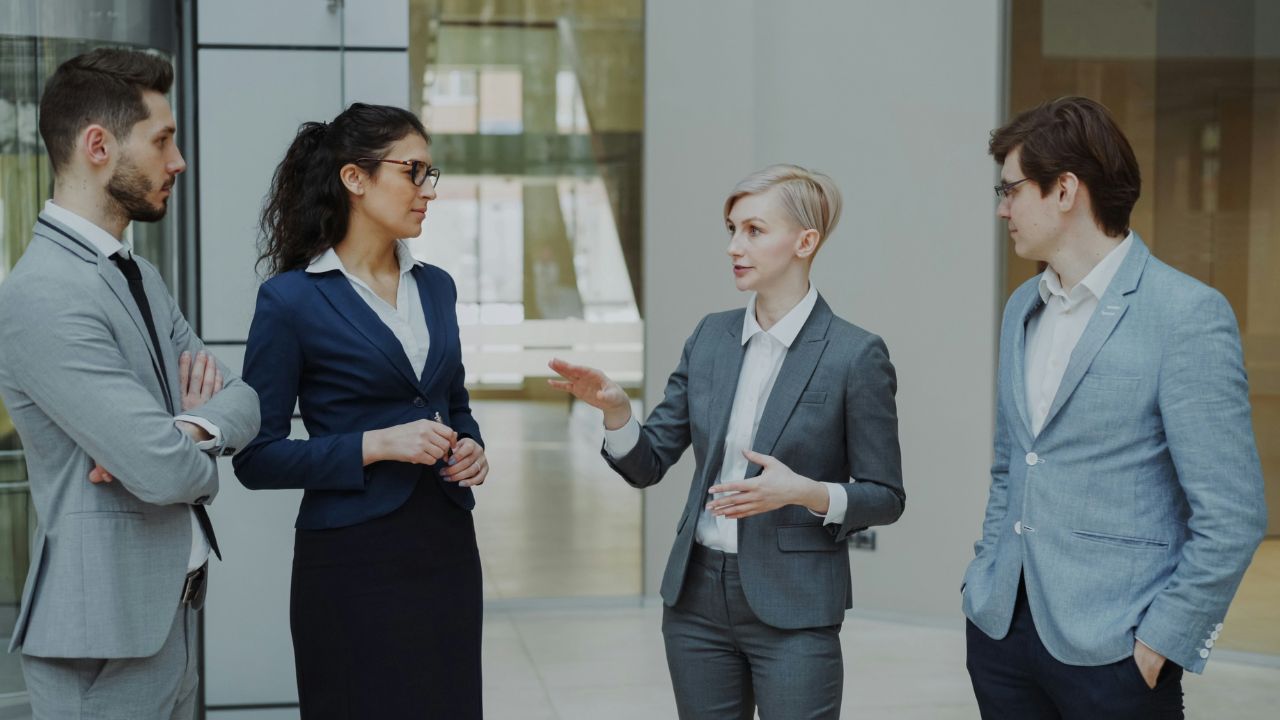 Executive walking an office corridor during an organisational transformation