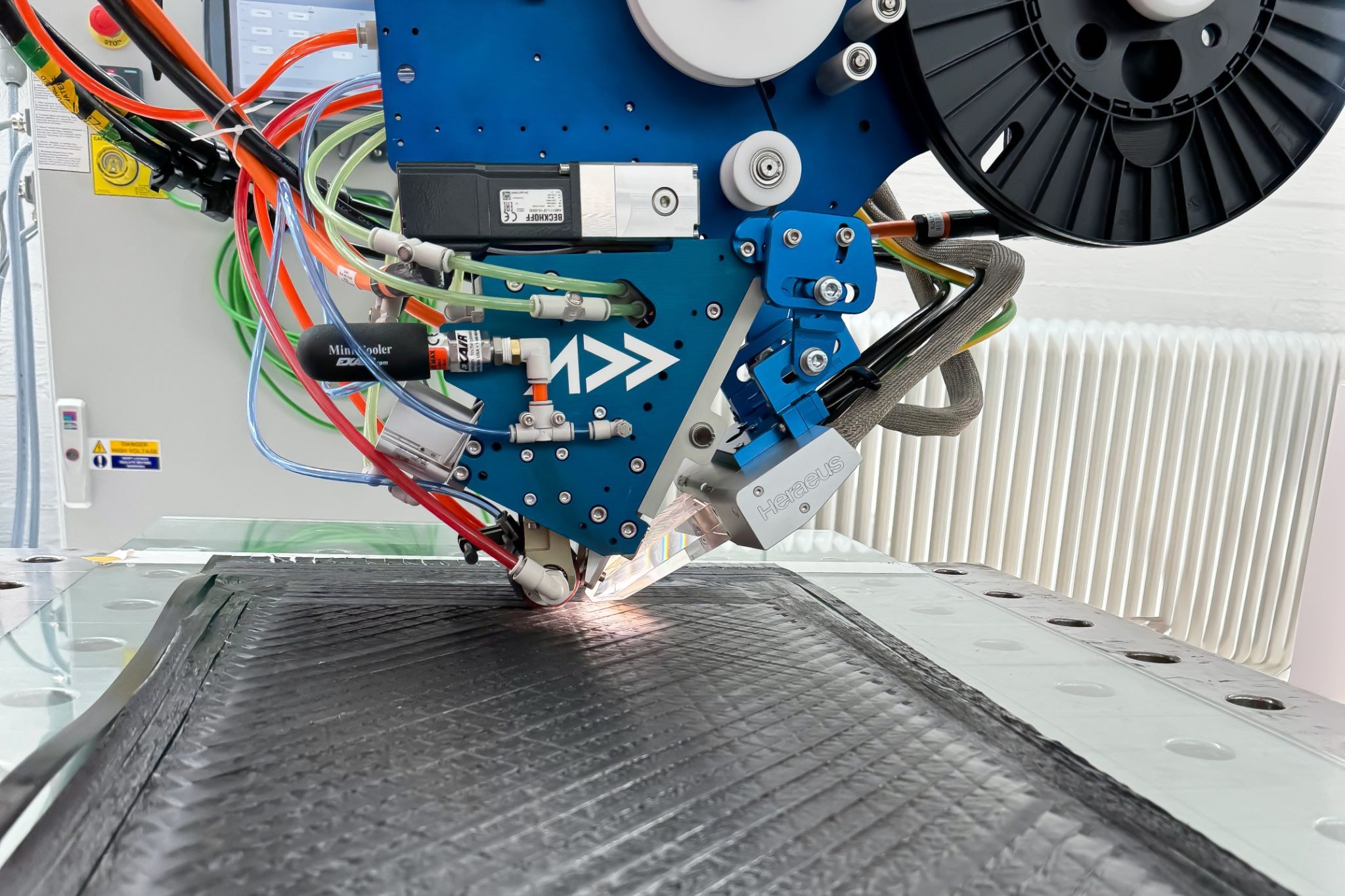 AFP-XS depositing CFRP tape