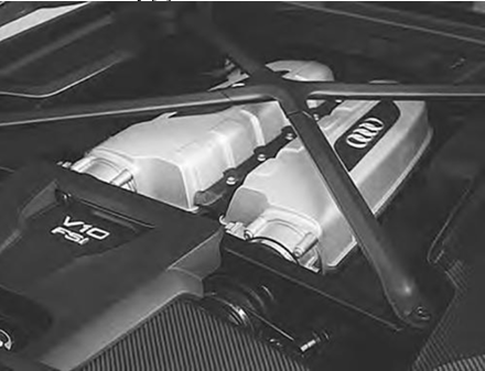 Carbon fiber engine support bracket in Audi R8 engine bay