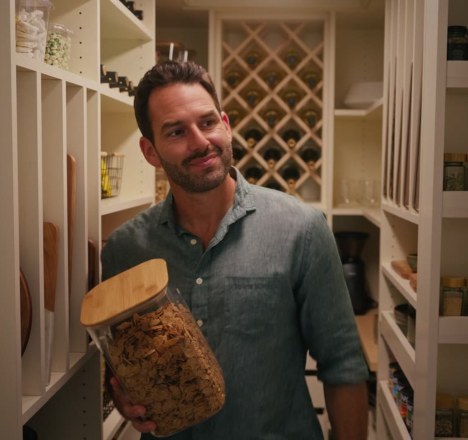 Homeowner in a custom Closet World pantry