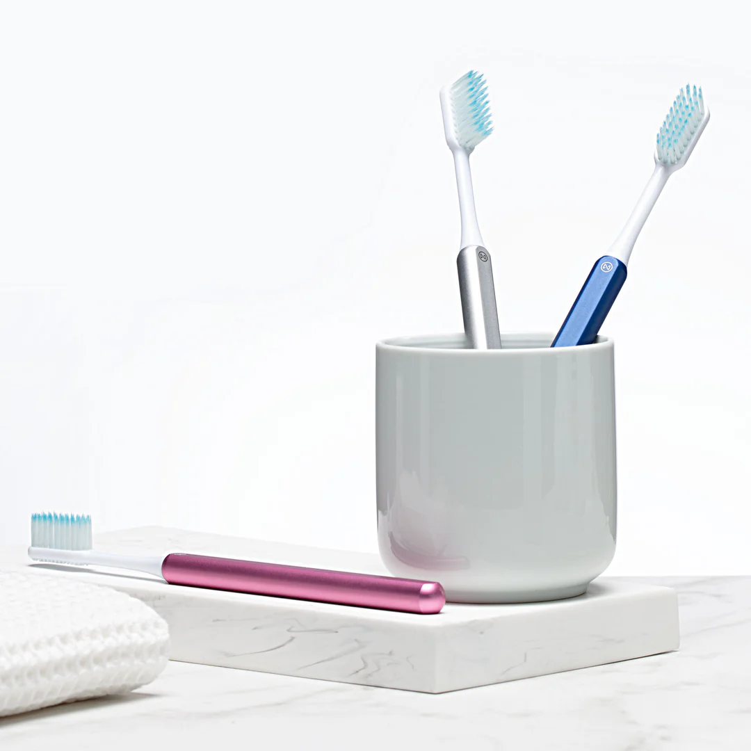Nada Toothbrush — pink, silver, and blue handles side by side | ANCORD Design Co