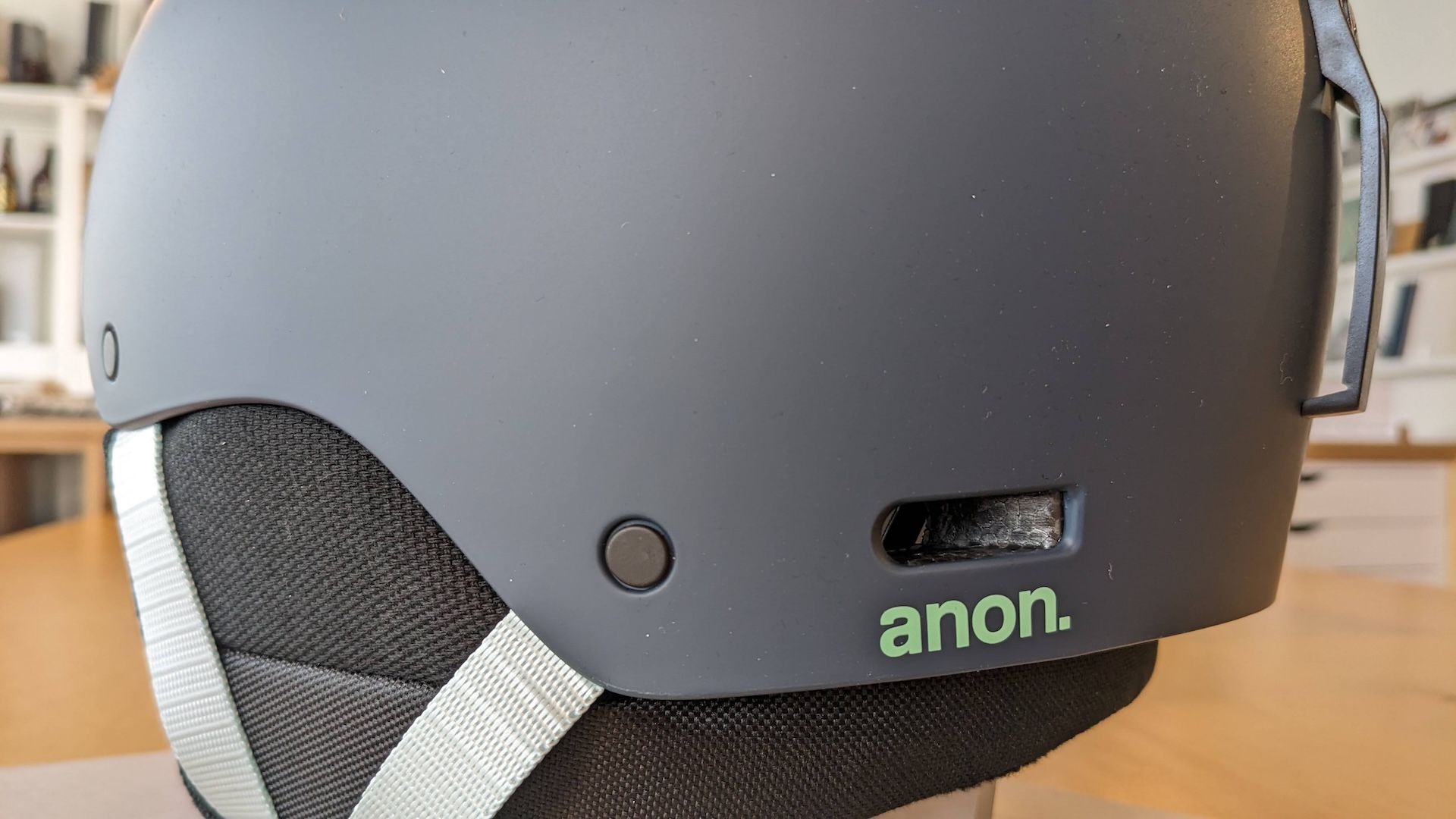 Burton / Anon — reference helmet on the ANCORD studio bench, side vent and anon logo close-up (photo) | ANCORD Design Co