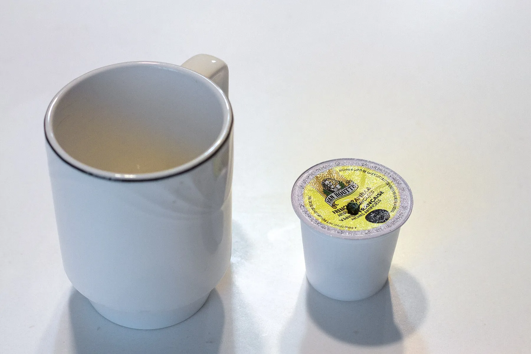 Used K-Cup coffee pods piled in a hotel room