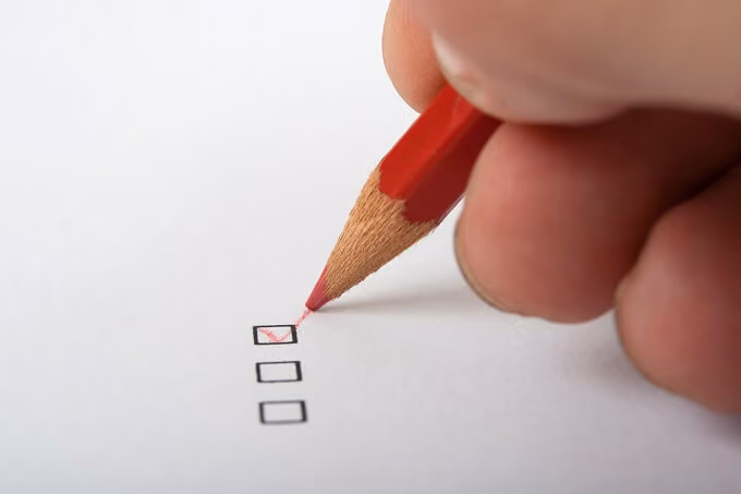 With a pencil checking a rental application